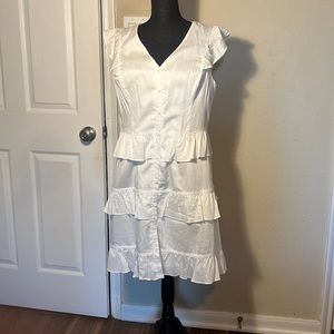 White Ruffle dress , has no stretch to it.